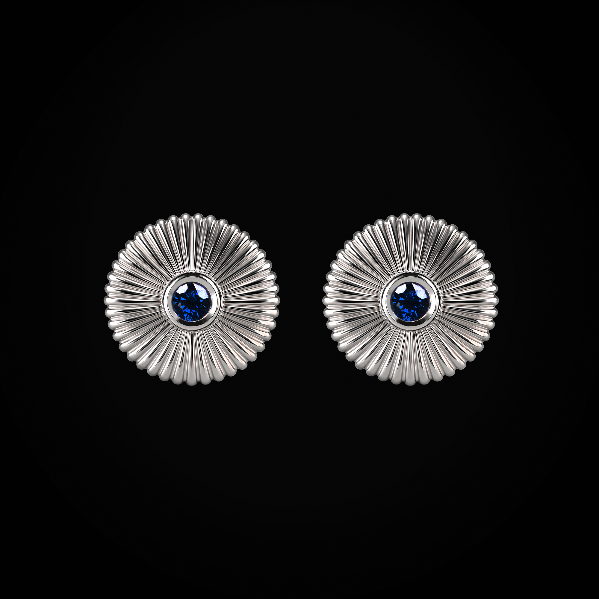 Arete flor fabergé circular troquelada zafiros azules centrales oro blanco 18k
