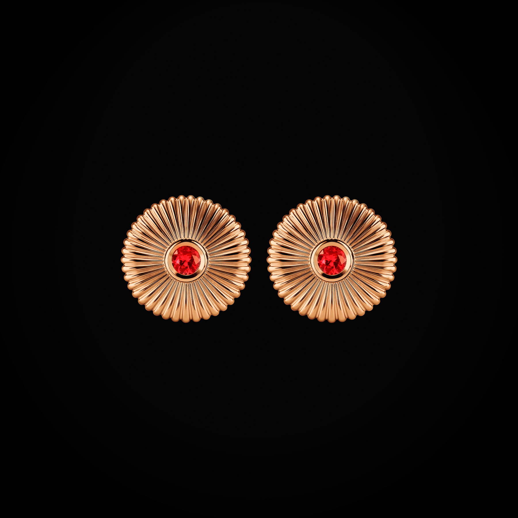 Arete flor fabergé circular troquelada rubís centrales oro rosa 18k