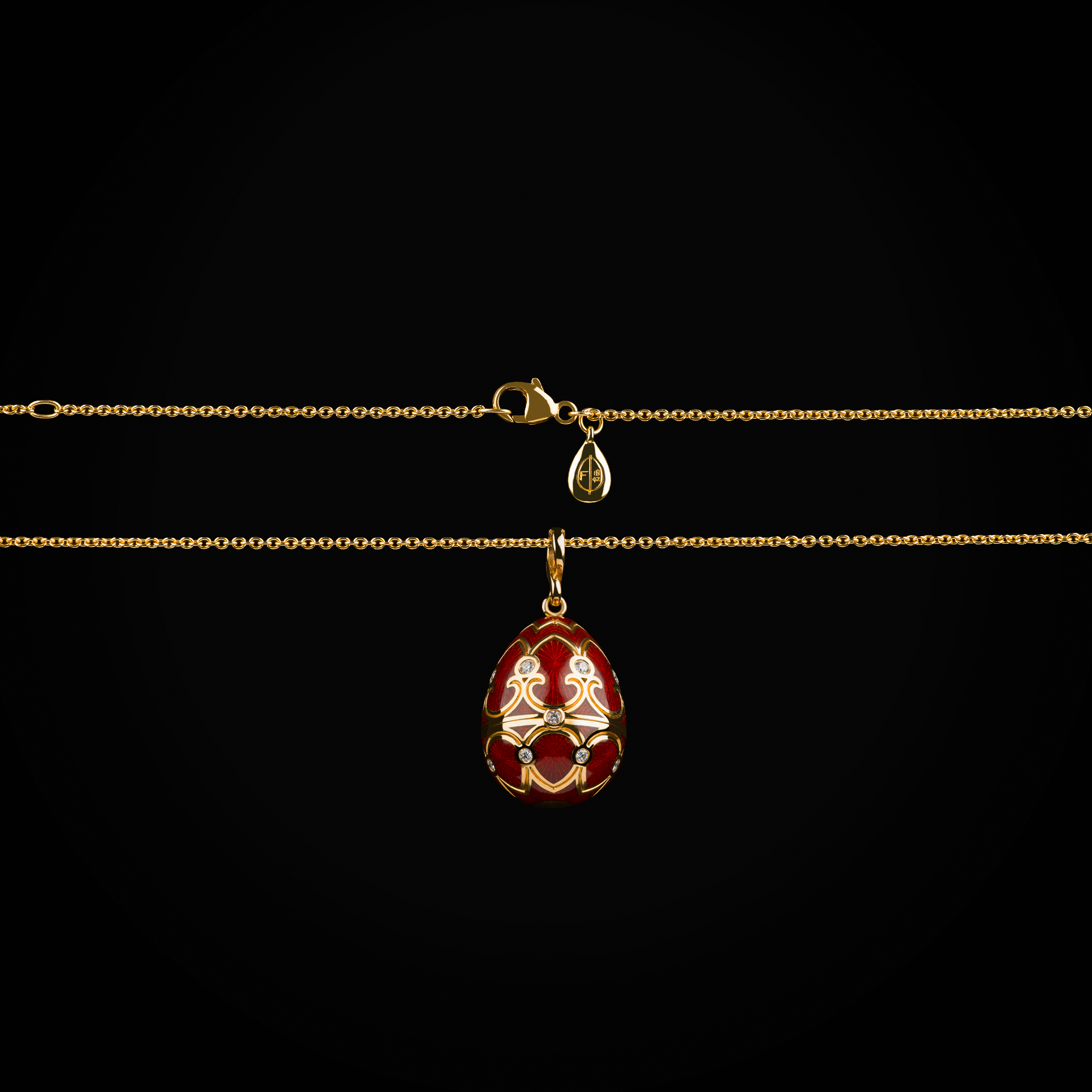 Cadena con dije huevo fabergé esmalte vitreo rojo corona interna purpura con rubís, esmeraldas, zafiros & cornalina de oro amarillo 18k