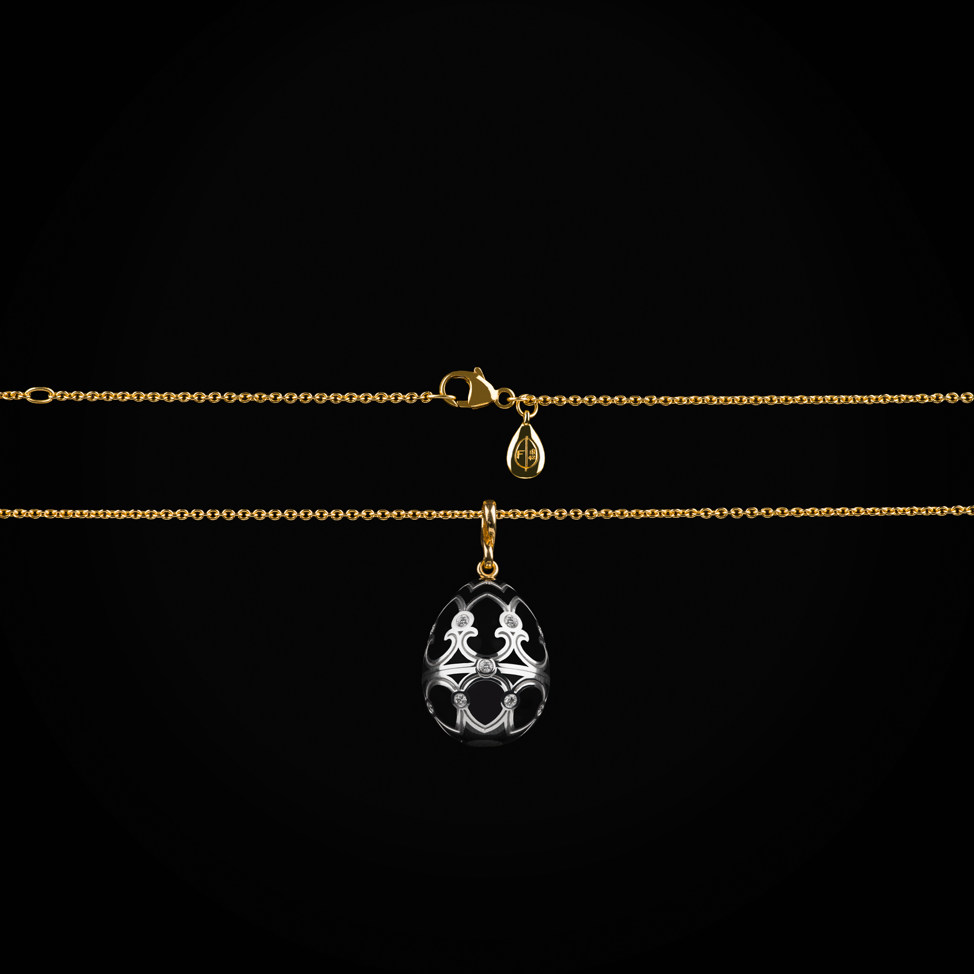 Cadena huevo fabergé esmalte vitreo negro con pingüino central sobre gema agata de oro amarillo y blanco 18k con diamantes de mina corte brillante